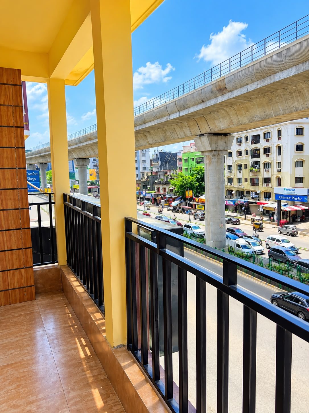 Balcony view over Chinar Park and the metro line